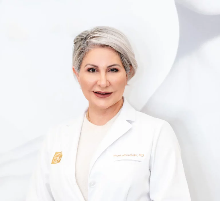 Dr. Monica Bonakdar in a white medical coat