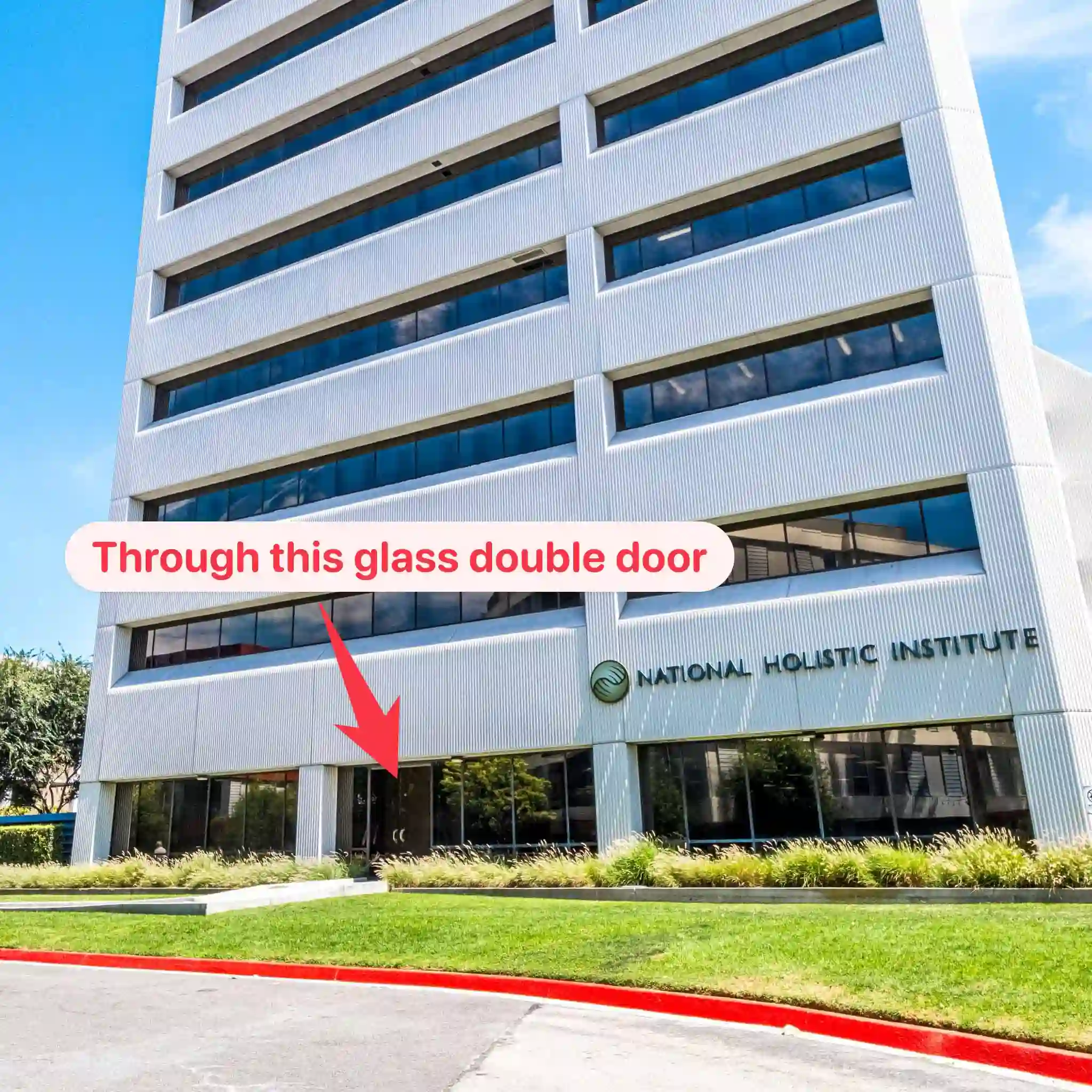 Calista entrance through the glass double doors beneath the National Holistic Institute sign