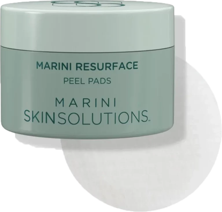 Green jar labeled Marini Resurface Peel Pads with a round white pad behind it.